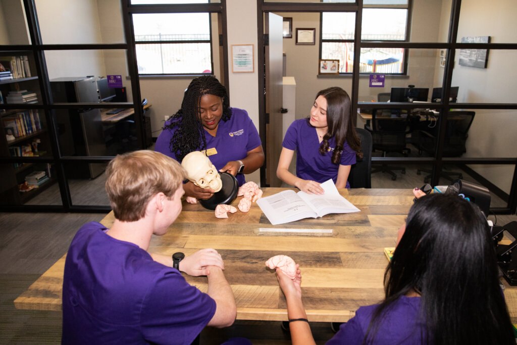 HSU Speech-Language Pathology Students studying at the table.