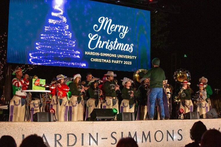 The band plays during the annual Christmas party on campus.
