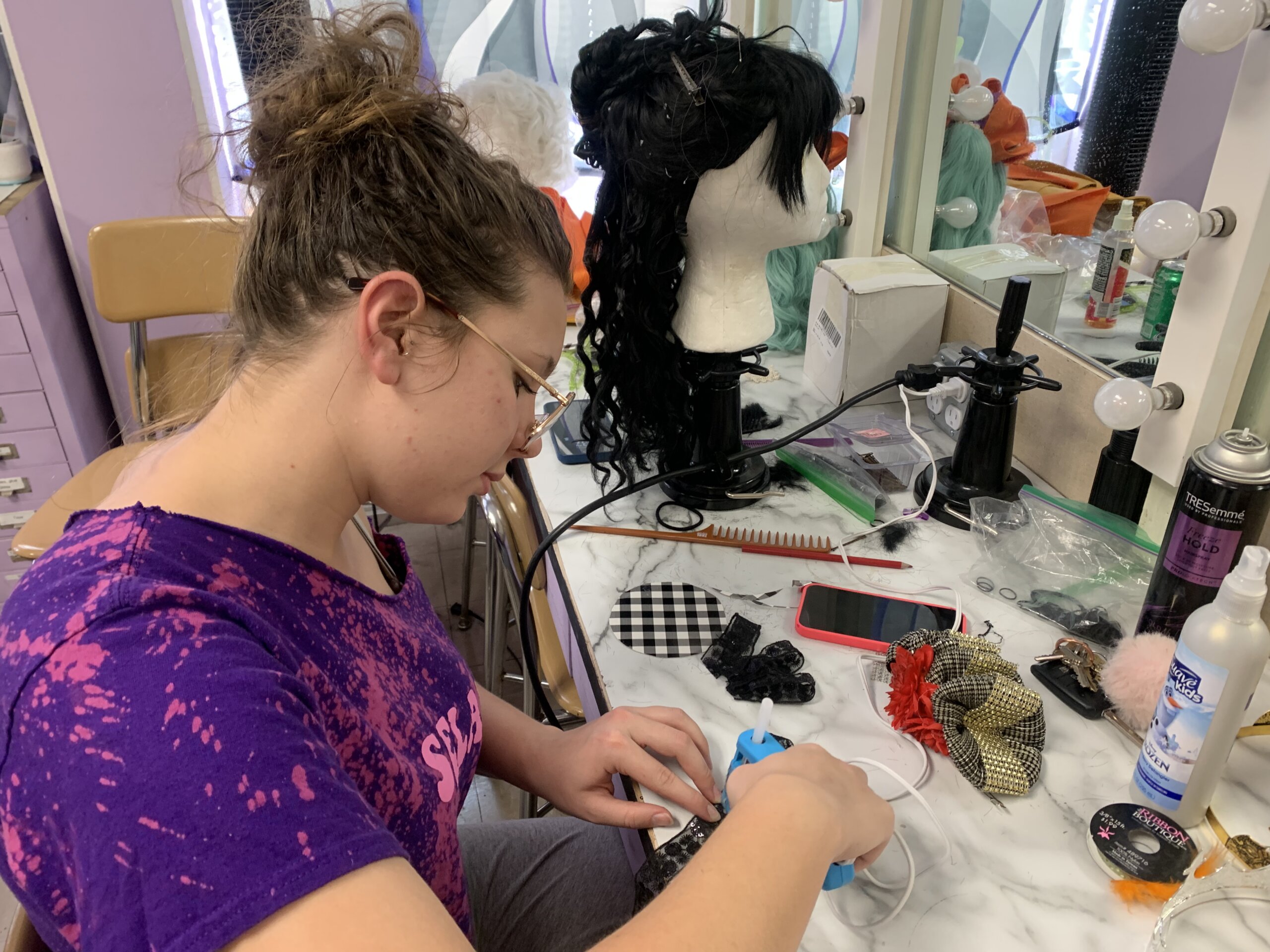 Theatre student working on costume