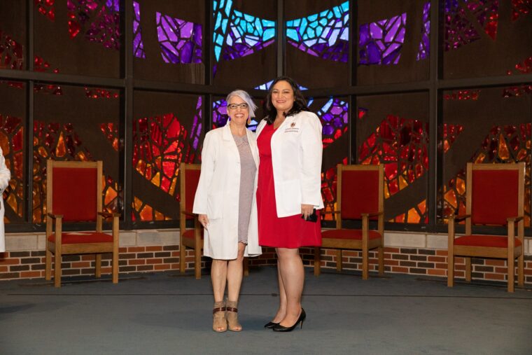 Veronica with Dr. Tina Butler standing in Logsdon Chapel.