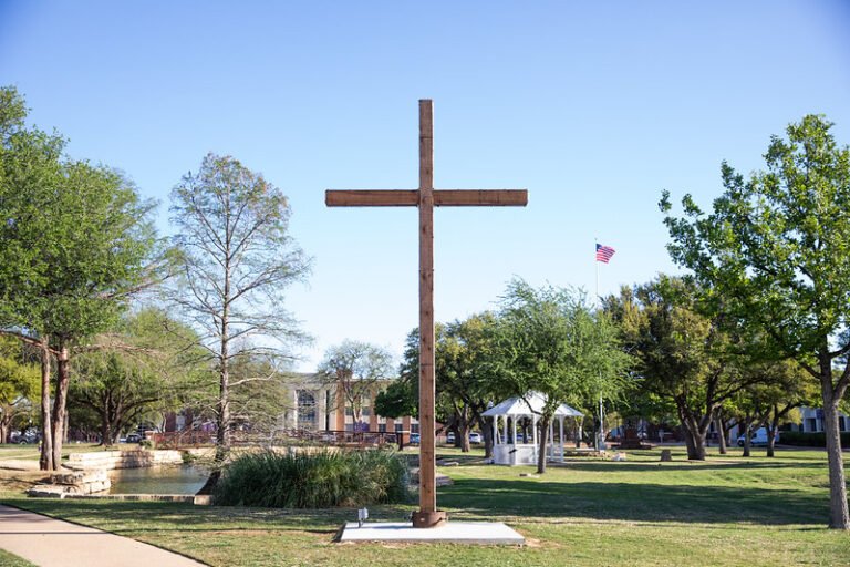 A cross stands in the middle of campus.