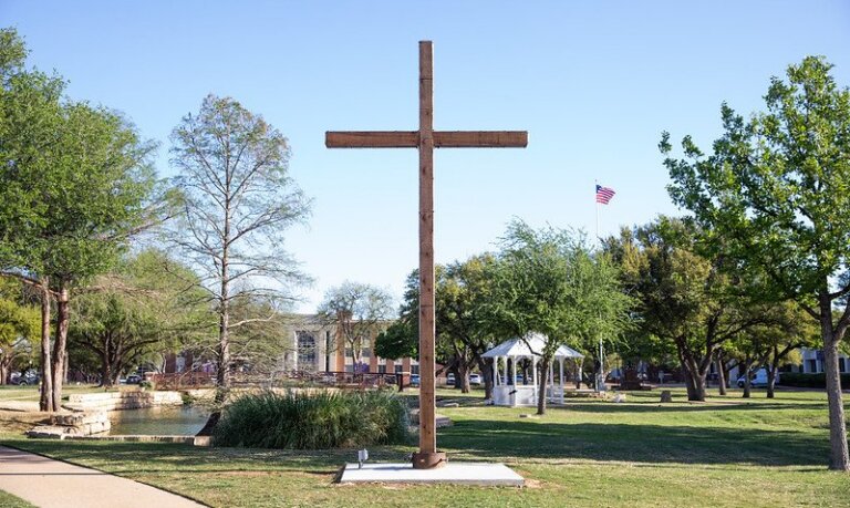A cross stands in the middle of campus.