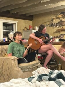 Maddox Carr leads worship during the retreat.