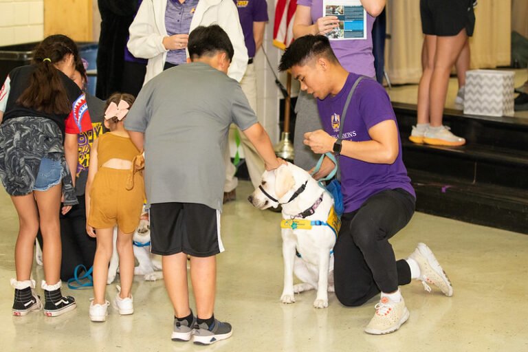 Ortiz E.S. students say hello to the puppies.