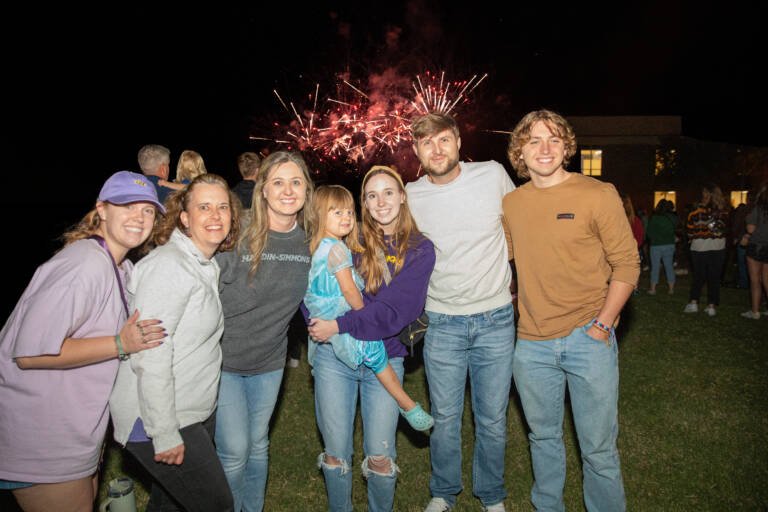 Family at HSU Homecoming 2024 during the fireworks show.