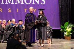 Liberal Arts student being presented an award at graduation