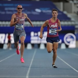 Tanner races next to his friend Thomas Normandeau of Canada.