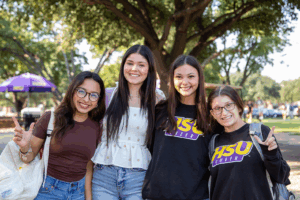 Students on campus smiling