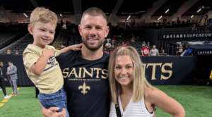 Luke Lancaster, Hardin-Simmons University alumnus and New Orleans Saints assistant strength and conditioning coach, poses for a photo with his family.