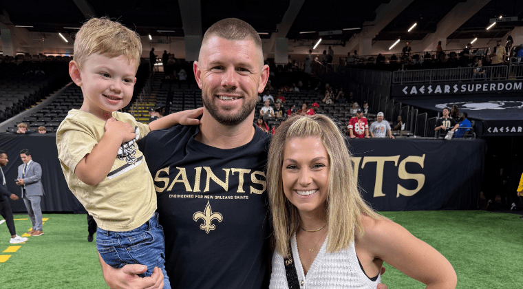 Luke Lancaster, Hardin-Simmons University alumnus and New Orleans Saints assistant strength and conditioning coach, poses for a photo with his family.