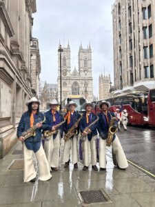 Kate Voss and fellow Cowboy Band members representing Hardin-Simmons University at the London New Year’s Day Parade, showcasing HSU tradition and Texas spirit on an international stage.