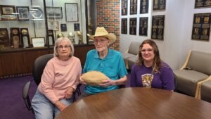 Three generations of HSU pride: Kate Voss with her grandparents, Charlene and Bill Voss, whose Hardin-Simmons University legacy began in 1960 and helped inspire Kate’s own journey through the Cowboy Band and the Six White Horses.