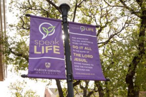 speakLIFE banner hung up on campus.