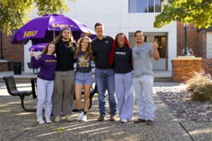Students posed for a photo outside of moody