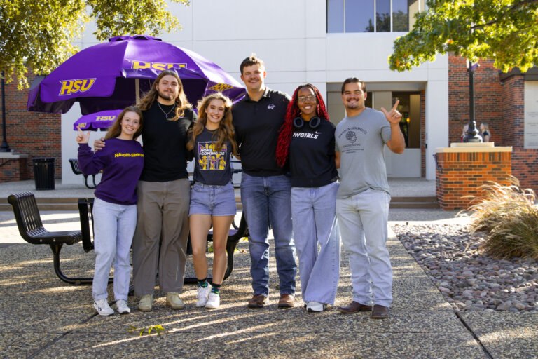 Students posed for a photo outside of moody