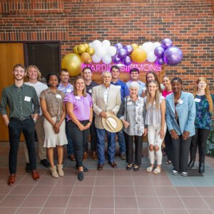 Newmans at the Scholarship Luncheon having their photo taken with their students