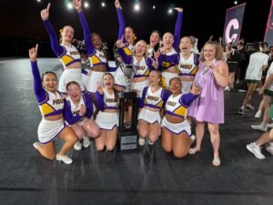 HSU Cheer celebrating their national championship win on stage