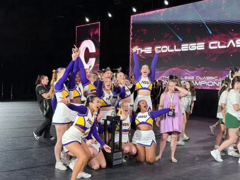 HSU Cheer celebrating their national championship win on stage