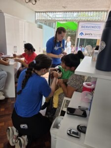 PA Students helping someone on their mission trip to Peru