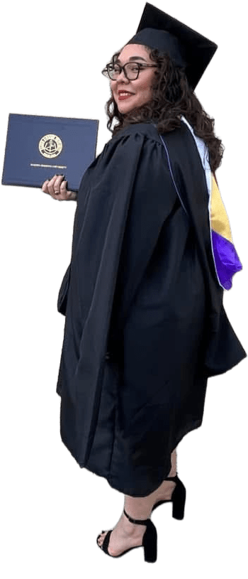 Student smiling with diploma, wearing cap and gown.