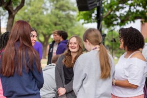 students talking on campus