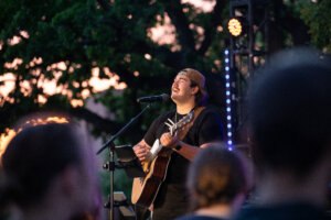 Student singing at Revive 25 event