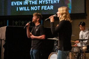 Two students singing in Chapel
