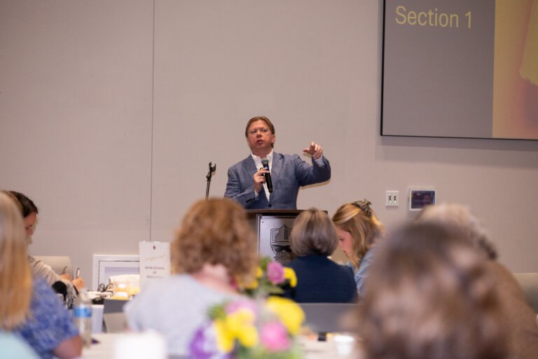 Person speaking to a crowd