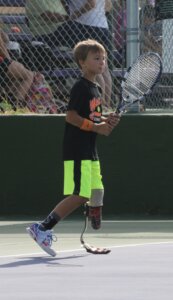 Keegan Ratliff as a kid playing tennis